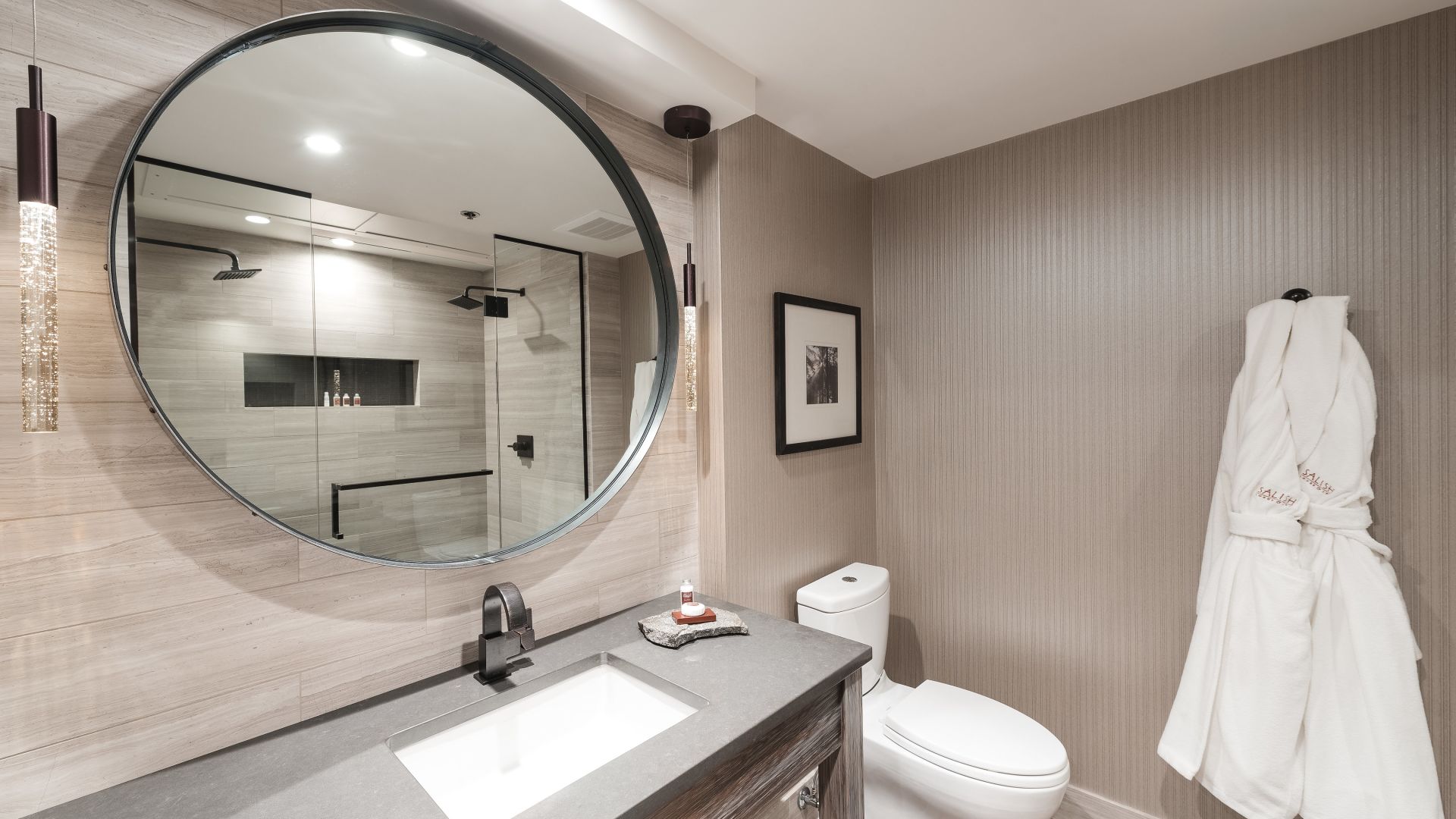 Classic Room — bathroom with round mirror and walk-in shower